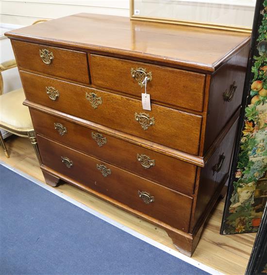 An early 19th century oak two part chest W.109cm